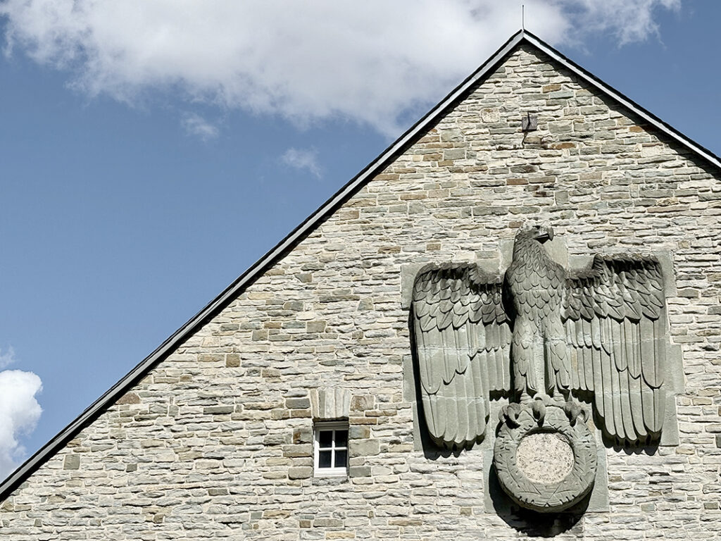 Eagle on the wall of the Horst Wessel Halle, part of the nazi Schulungsburg in Erwitte