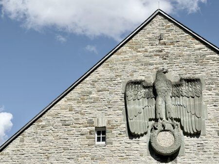 Eagle on the wall of the Horst Wessel Halle, part of the nazi Schulungsburg in Erwitte