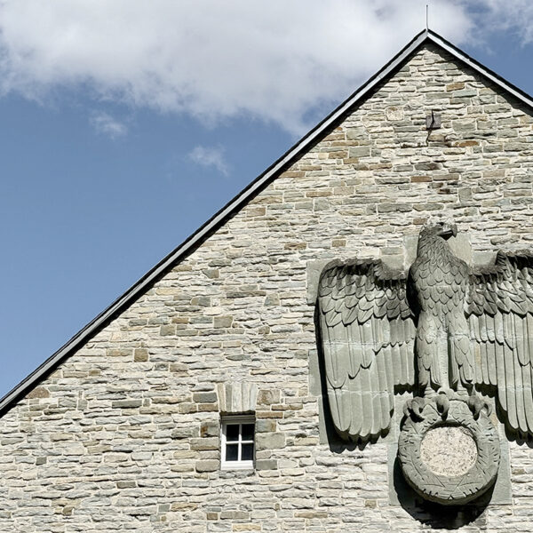 Eagle on the wall of the Horst Wessel Halle, part of the nazi Schulungsburg in Erwitte